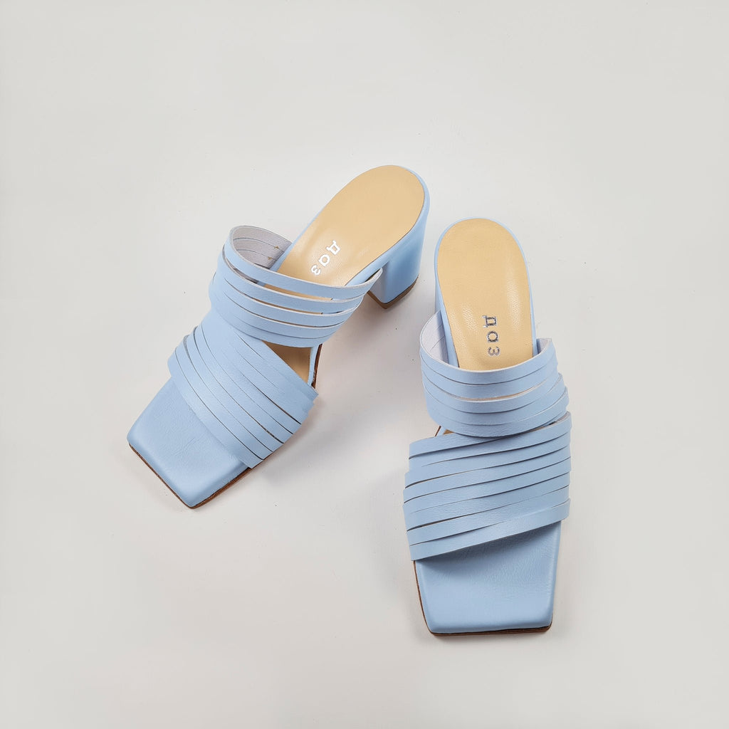 3. Side view of women's light blue leather sandals by Daz Studio, highlighting strappy design and squared toe