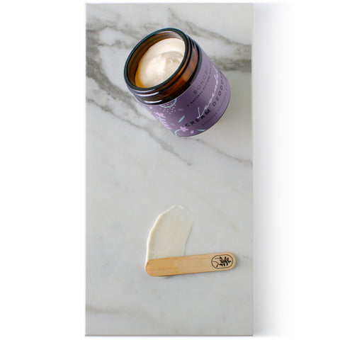 4. Open jar of BONOBO Lavendel Deodorant-Cream with cream spread on marble surface