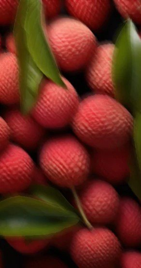 3. Close-up of lychee fruits with green leaves, highlighting fragrance component
