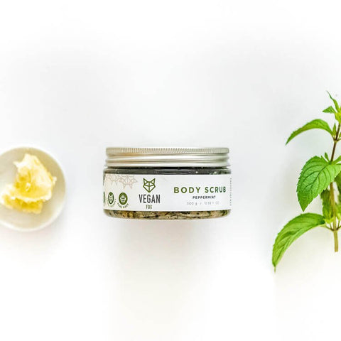 3. Vegan Fox Peppermint Body Scrub jar with shea butter and peppermint leaves, studio setting
