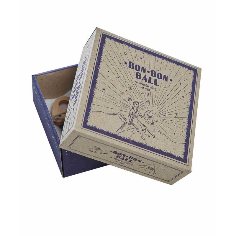 4. Open cardboard box packaging for Wooden Story Bon Bon Ball toy with illustrated design and branding