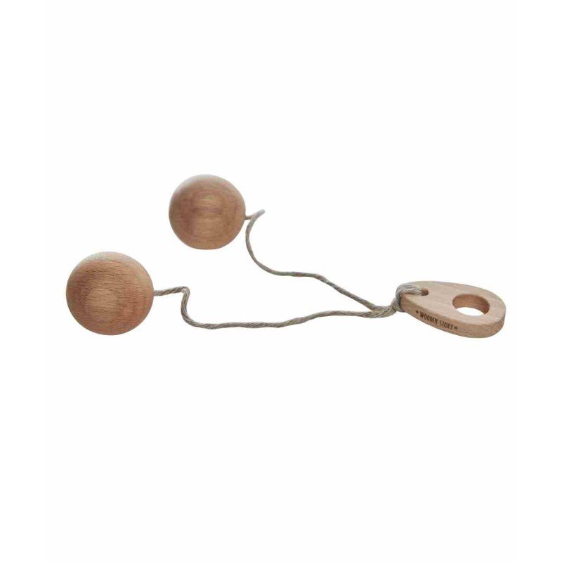 2. Studio shot of Wooden Story Bon Bon Ball toy with two wooden balls connected by string and a wooden handle on a white background
