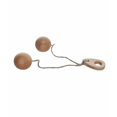 2. Studio shot of Wooden Story Bon Bon Ball toy with two wooden balls connected by string and a wooden handle on a white background
