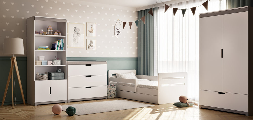 1. Bright children's bedroom featuring white Tomi bookshelf, bed, and dresser, styled with toys and bunting decor