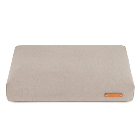 2. Beige Bosca dog cushion by Labbvenn with leather logo tag, shown on a white background highlighting its sleek and modern design.
