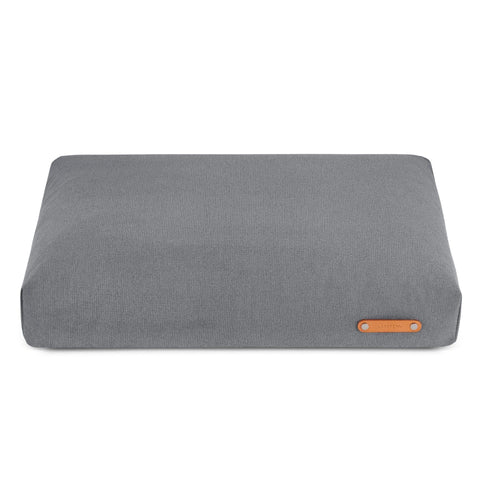 2. Grey Bosca dog cushion by Labbvenn with leather logo tag, shown in studio setting highlighting its sleek design and soft texture