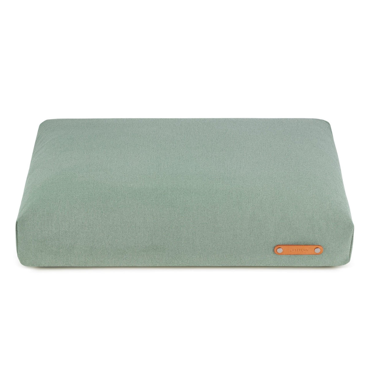 2. Soft teal dog cushion by Labbvenn with leather logo tag on clean white background, showcasing modern design and high-quality materials