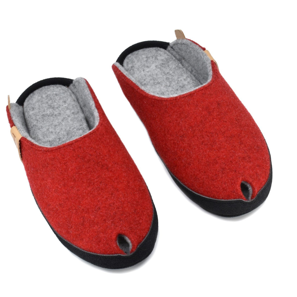 1. TOKU Brussels red slippers in natural lambswool felt with black microfibre sole, shown in studio setting