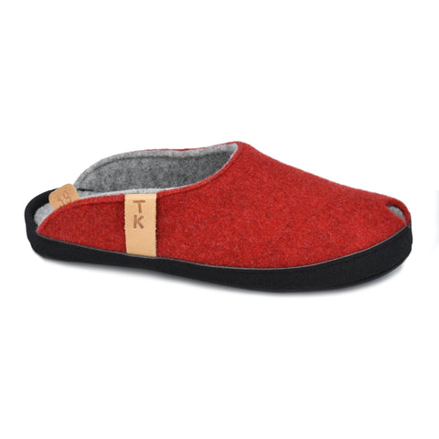 2. Side view of TOKU Brussels red slippers with black microfibre sole and TK branding, studio shot