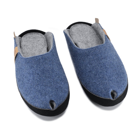 1. TOKU Brussels blue slippers in natural lambswool felt with black microfibre sole, shown in studio