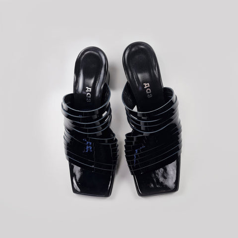 3. Top view of women's black strappy patent leather sandals with squared toe design