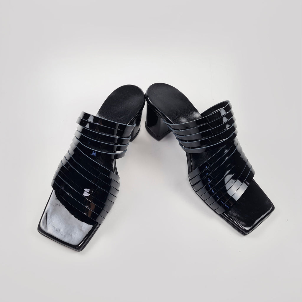 6. Overhead view of women's black strappy patent leather sandals with squared toe
