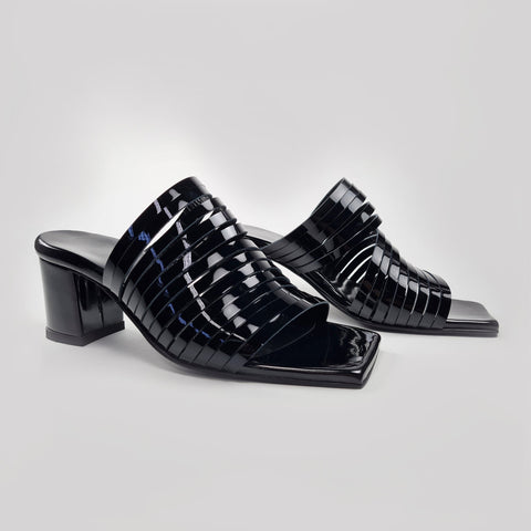 4. Side view of women's black patent leather sandals with 6 cm heel, highlighting strappy design