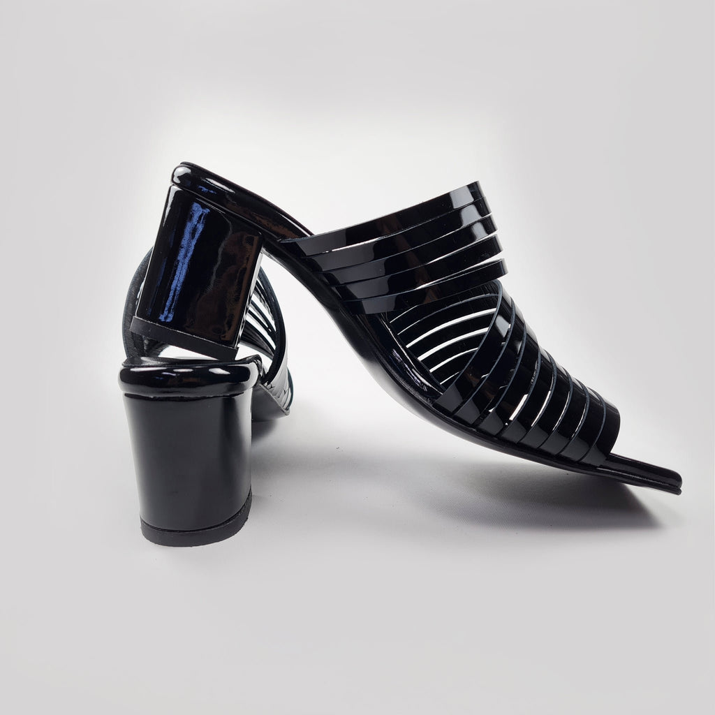8. Women's black patent leather sandals with block heel, highlighting strappy design from back