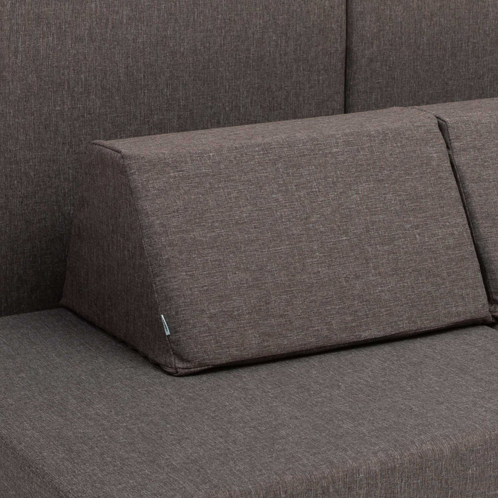 10. Close-up of Monboxy dark brown trapezoidal pillow on play mattress set