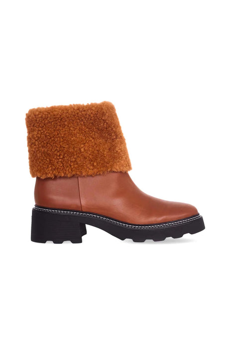 2. Women's brown leather ankle boots with decorative shearling and block heel on white background