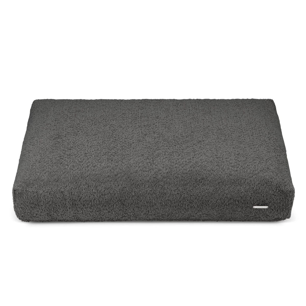 2. Anthracite Buklaa dog cushion in studio setting showing textured loop yarn surface and rectangular shape