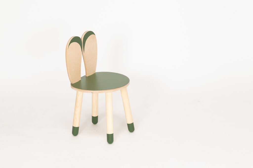 1. Wooden bunny chair for kids in natural birch with green accents on legs and seat, studio setting
