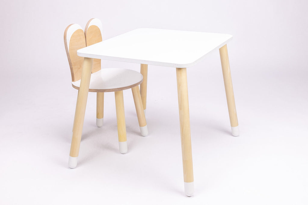 2. Studio shot of white and natural wood bunny-themed table and chair set with rounded edges