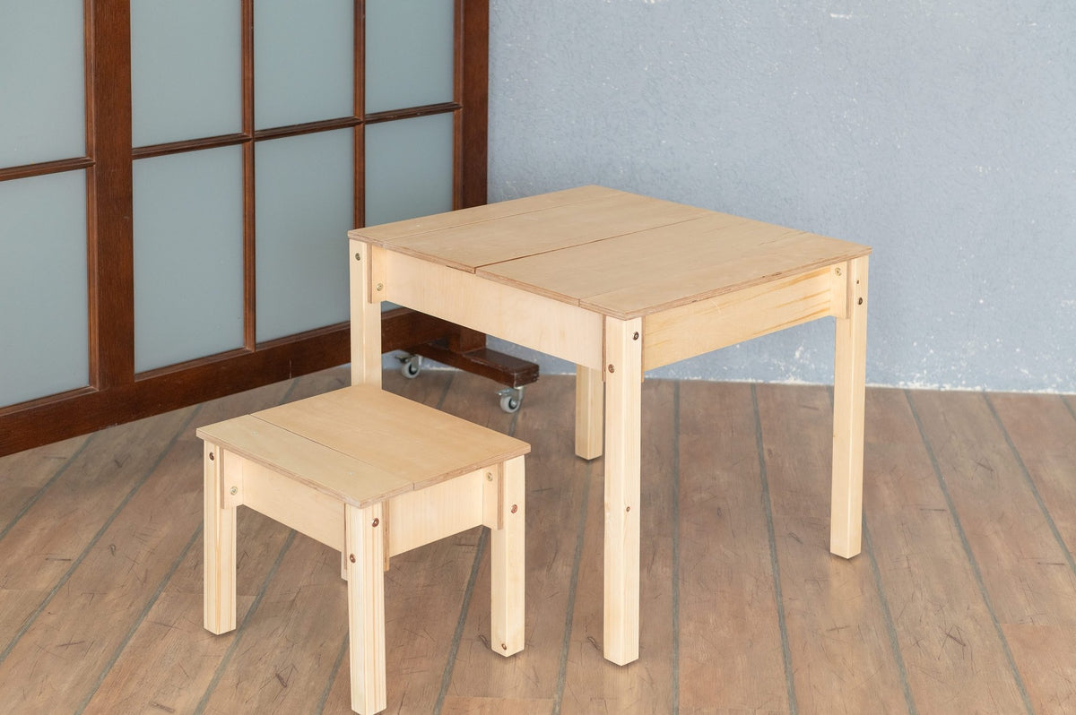 2. Studio shot of children's smart storage table and chair set in light wood, closed storage compartments