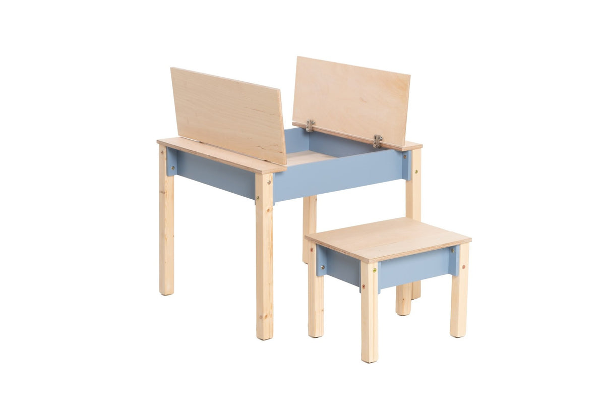 2. Studio shot of children's smart storage table and chair set in light wood and grey, showing open storage compartments