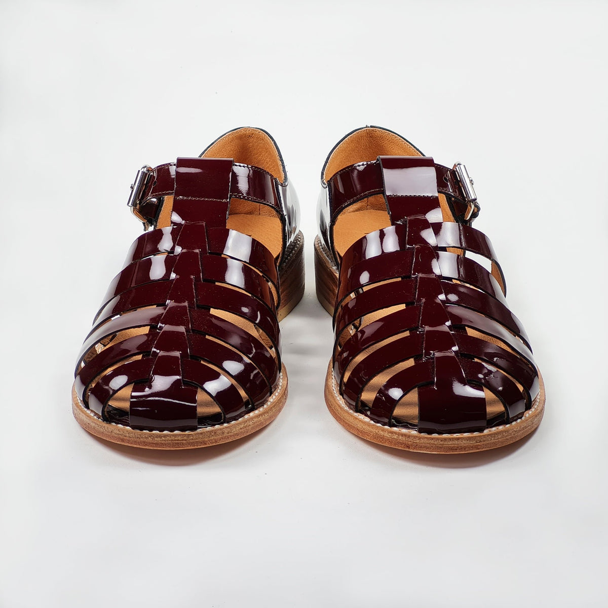 4. Handmade burgundy leather fisherman sandals by Daz Studio, front view in studio