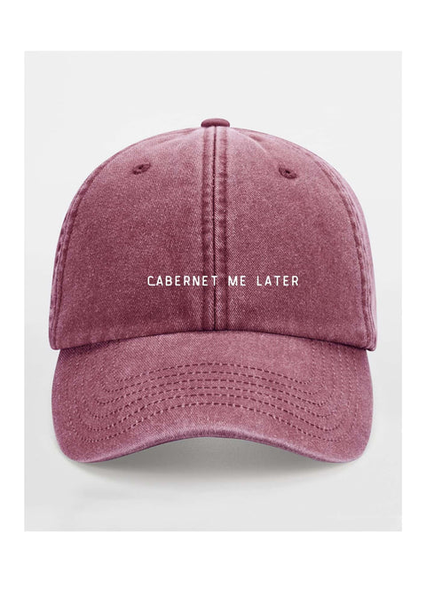 3. Burgundy cap with 'Cabernet Me Later' text on clean white background