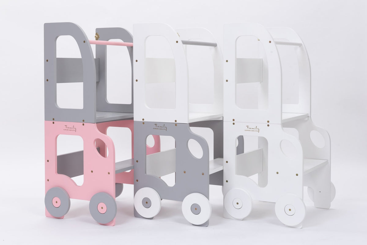 2. Pink, grey, and white Montessori kitchen step stools with wheel design on white background