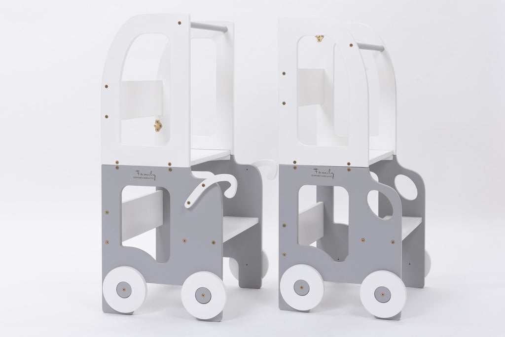 2. Two grey and white Montessori kitchen step stools with wheel design on white background