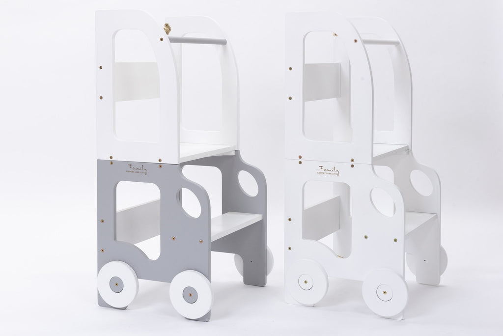 2. Two grey and white Montessori kitchen step stools with wheel design on white background