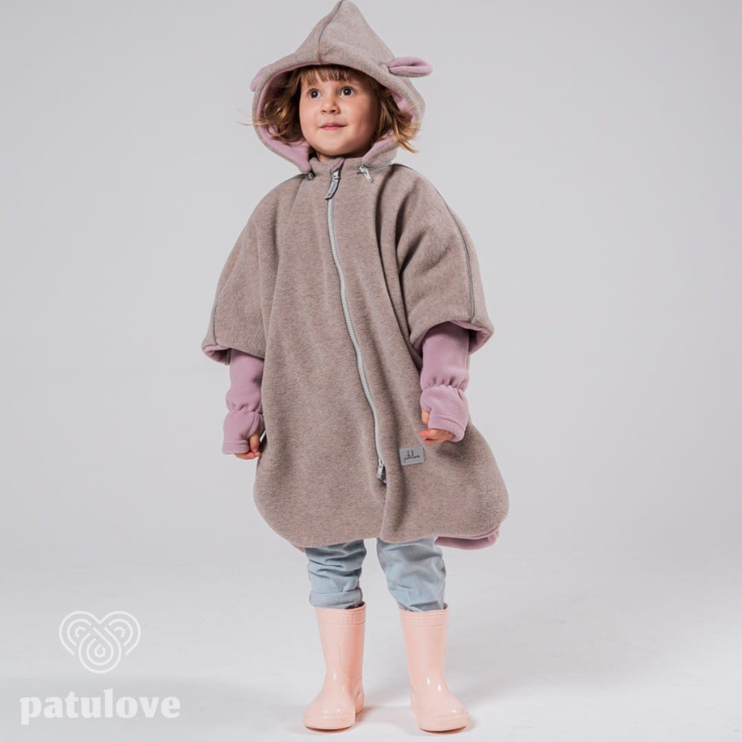 6. Child in Patulove pink lamb car poncho with hood and pink boots, standing in studio