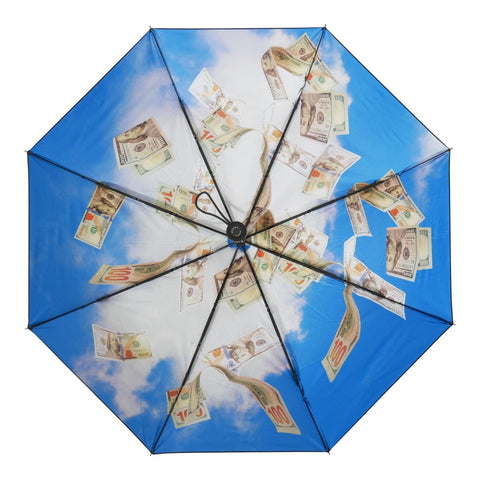 3. Open Cash Flow umbrella showing full cash print design against blue sky