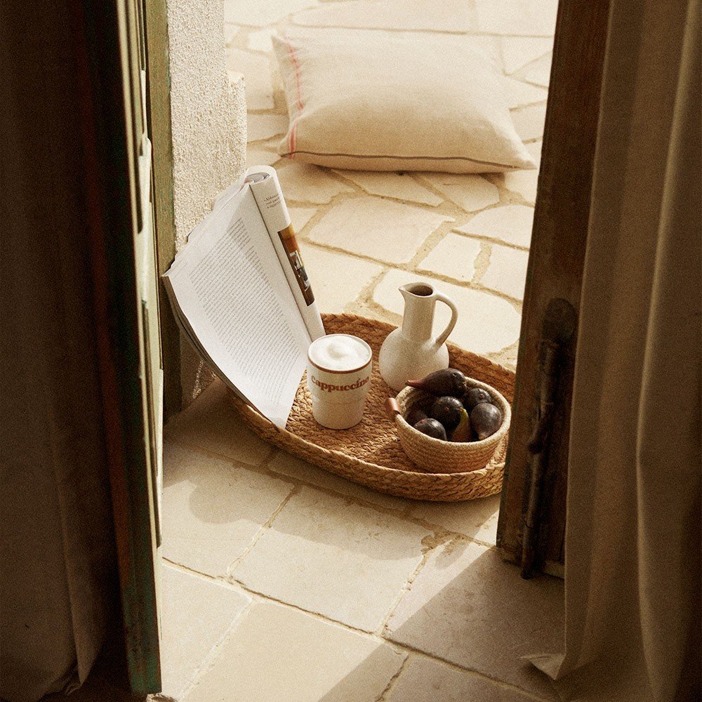 2. Terra Mamma ceramic cappuccino mug on tray with figs and magazine by open door