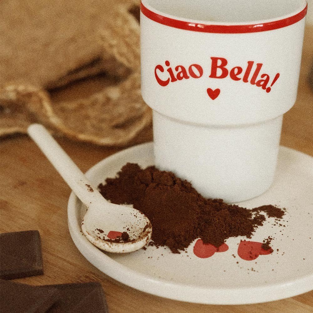 3. Close-up of Terra Mamma 'Ciao Bella!' ceramic mug with cocoa powder on plate and spoon