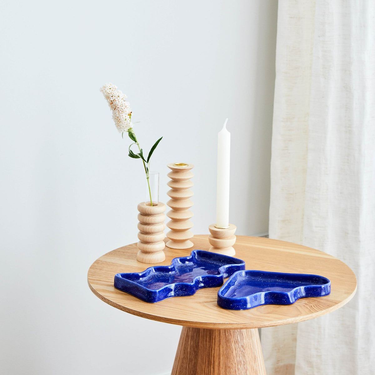 2. Ceramic Wave Tray in Rectangular Blue by 5mm Paper on wooden table with decorative items