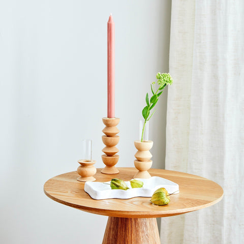 3. Ceramic Wave Tray in speckled white on a wooden table with candle and decor