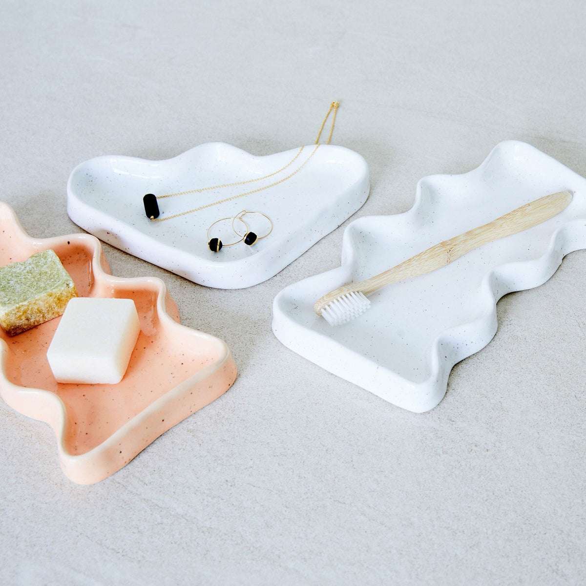 4. Ceramic Wave Tray in speckled white and peach used for jewelry and toiletries