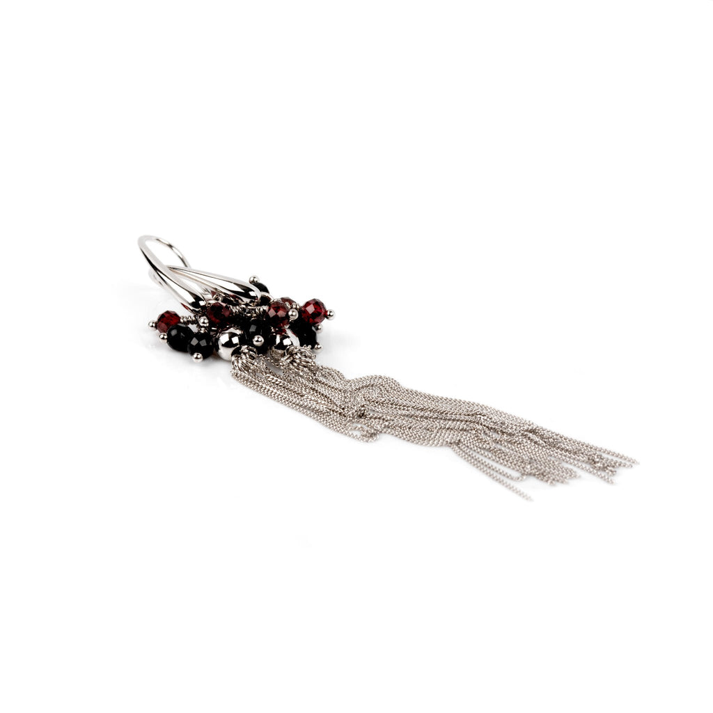 2. Close-up of MyaMoon Cherie black tassel earring in silver plating, showcasing elegant design