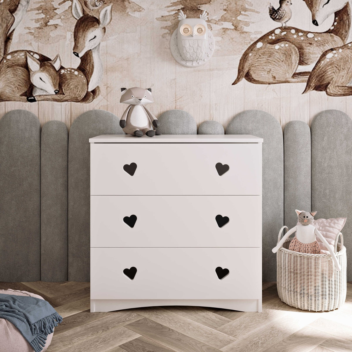 1. White chest of drawers with heart-shaped handles in a child's room with animal-themed decor
