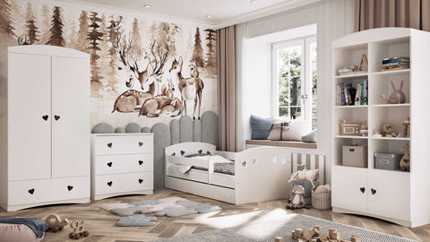 1. White chest of drawers with heart-shaped handles in a children's room with woodland decor