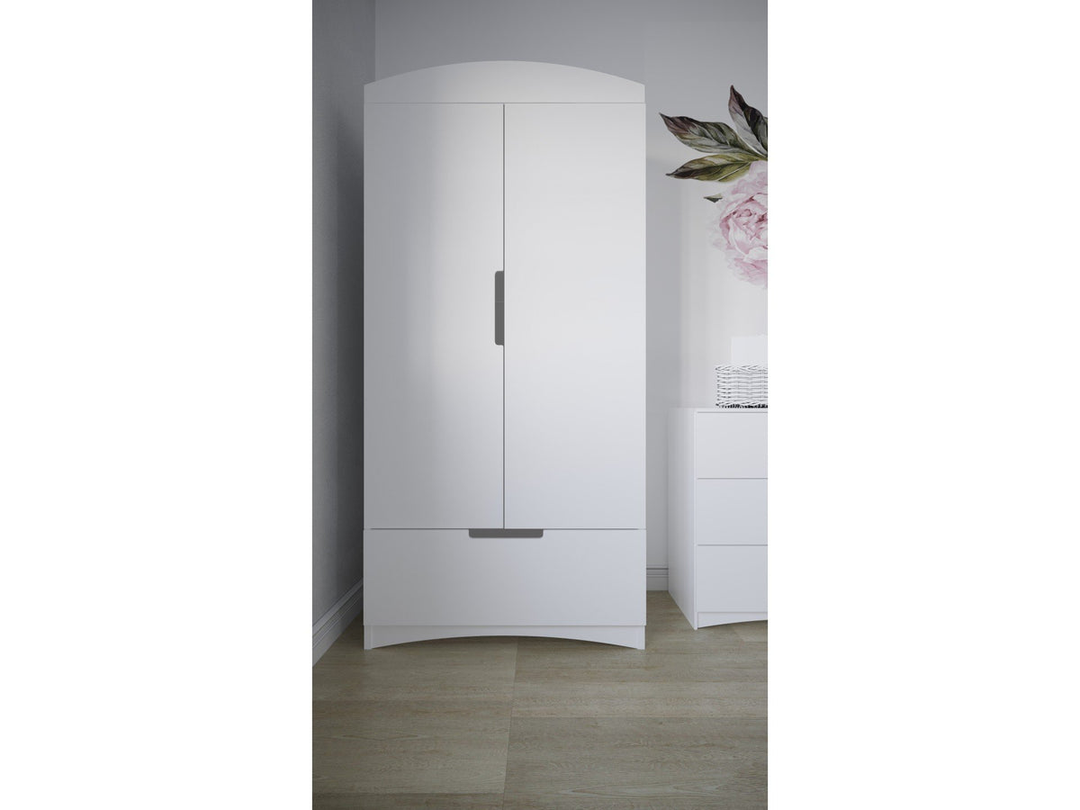 8. Kocot Kids white Classic wardrobe in bright room with floral decor