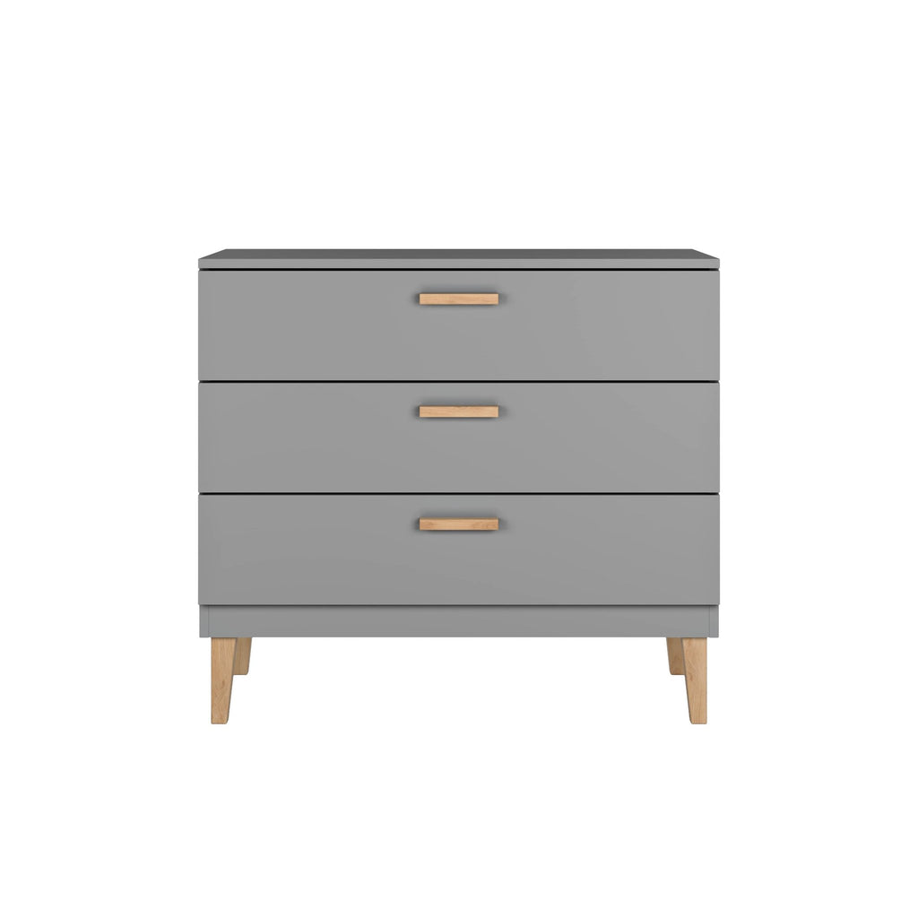 1. Front view of Kocot Kids Kubi grey chest of drawers with three spacious drawers and solid oak legs