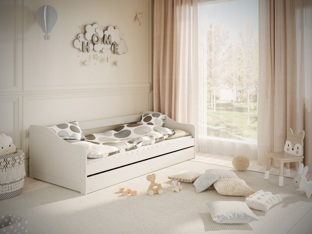 1. Children's white bed with polka dot bedding in a cozy, sunlit room with toys and decor