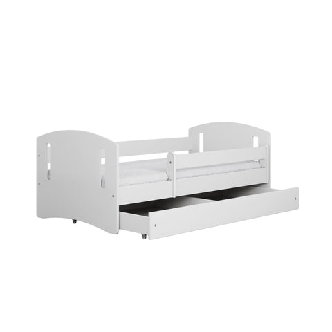 2. White children's bed with pull-out storage drawer and guardrail in studio setting