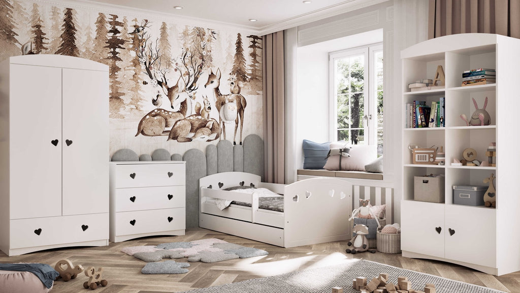 3. White children's bed with heart cutouts in a woodland-themed room with matching furniture and decor