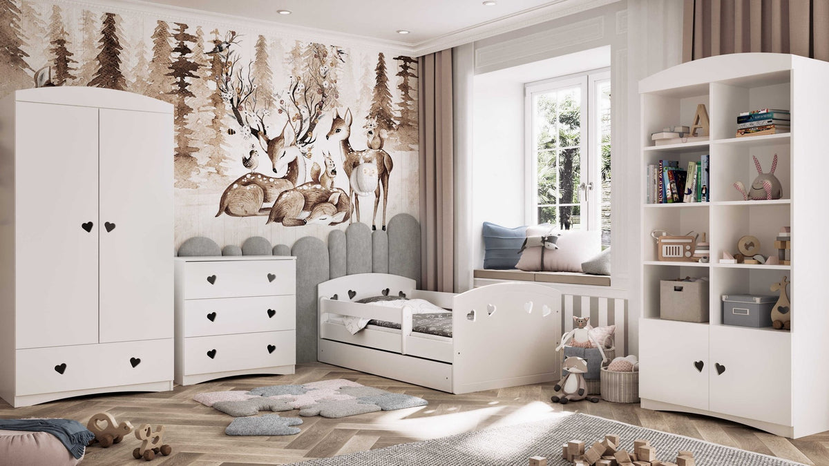 3. White children's bed with heart cutouts in a woodland-themed room with matching furniture and decor