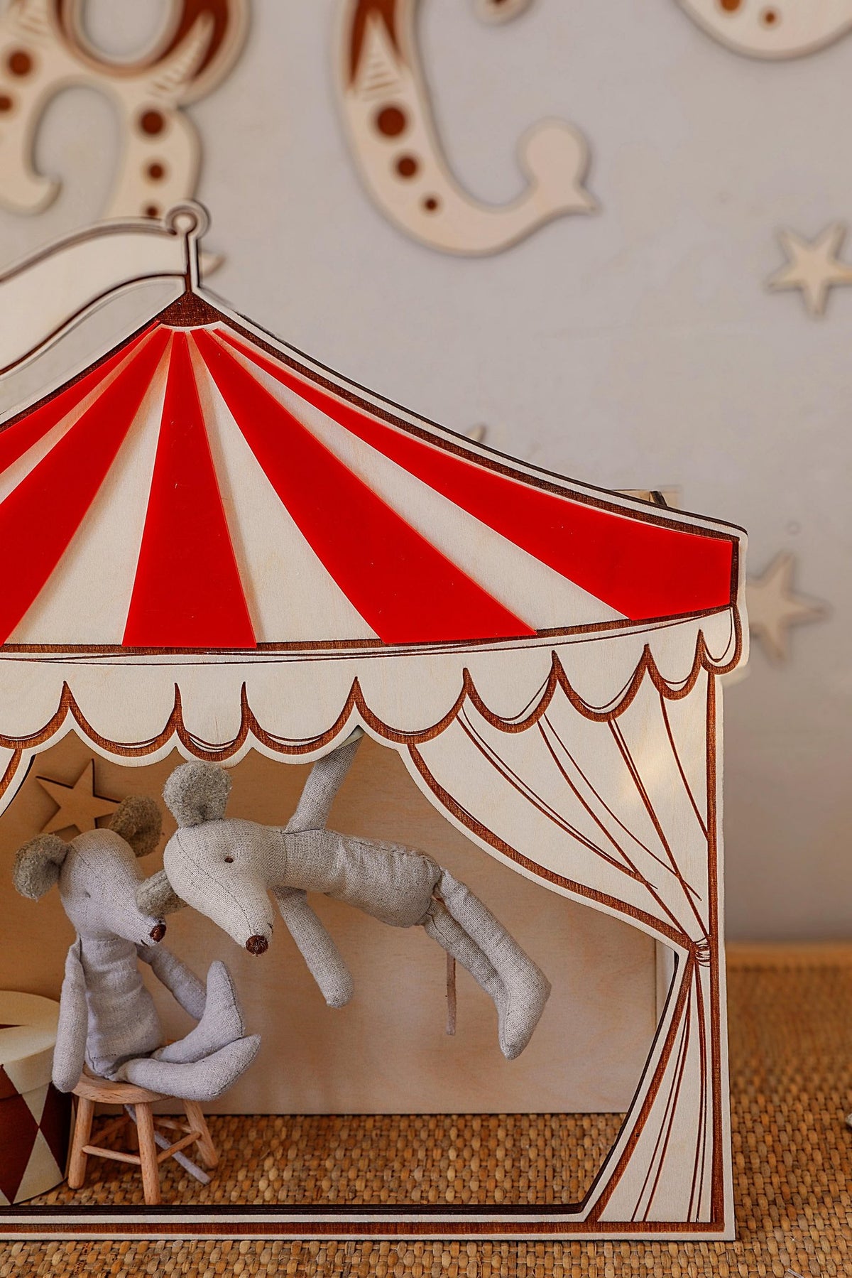 3. Close-up of red and white circus puppet theater with plush toys, highlighting detailed design and vintage appeal