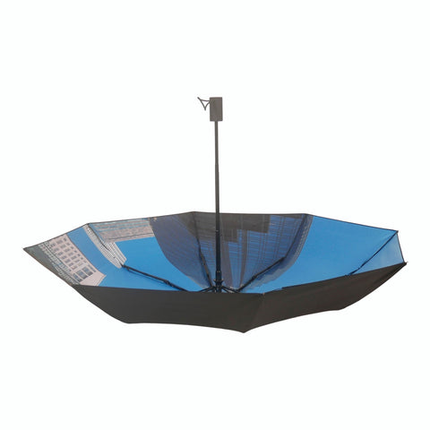 3. City umbrella partially open, displaying blue cityscape interior and black exterior, highlighting automatic feature