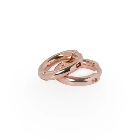 4. Close-up of MyaMoon rose gold small hoop earrings, featuring clip fixing and shiny rose gold plating