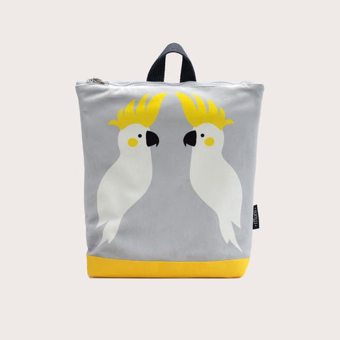 3. Muni Cockatoo kids backpack in studio, featuring cockatoo design and yellow base